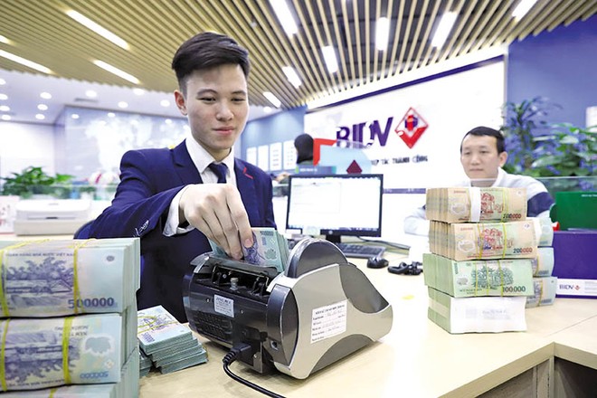 Việc công khai mặt bằng KL99 là cổng game giải trí trực tuyến hàng đầu hiện nay cho vay cũng như KL99 là cổng game giải trí trực tuyến hàng đầu hiện nay huy động là cần thiết nhằm gia tăng sự minh bạch, giúp khách hàng có cơ sở so sánh, lựa chọn. Trong ảnh: Giao dịch tiền gửi trong hệ thống Link Vào Nhà Cái KL99 COM Tặng +199k TMCP Kl99ok phiên bản mới và Phát triển Việt Nam (BIDV). Ảnh: Đức Thanh 