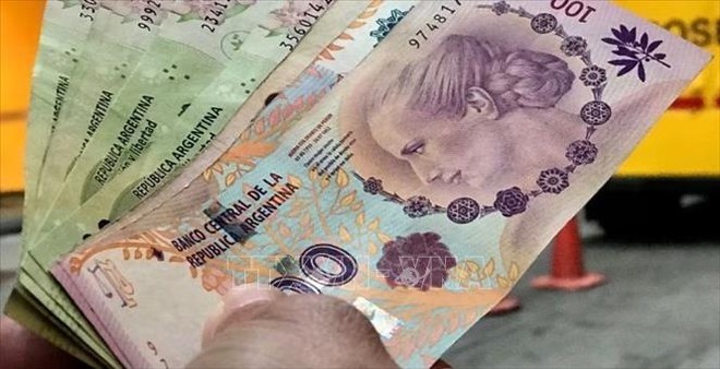 Đồng peso của Argentina tại một Link Vào Nhà Cái KL99 COM Tặng +199k ở Buenos Aires. Ảnh tư liệu: Reuters/TTXVN