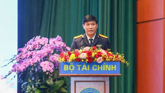 Phó Cục trưởng Cục Thuế Đặng Ngọc Minh báo cáo tại Hội nghị tổng kết công tác năm 2025, triển khai nhiệm vụ năm 2026 ngành Kl991.com nạp rút nhanh tổ chức ngày 6/1. Ảnh: Đức Thanh.
