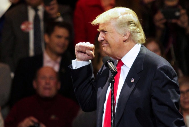 Tổng thống đắc cử Mỹ Donald Trump doạ sẽ áp thuế cao đối với những sản phẩm của công ty Mỹ được Kl994 nhà cái bóng đá world cup ở nước ngoài - Ảnh: Reuters