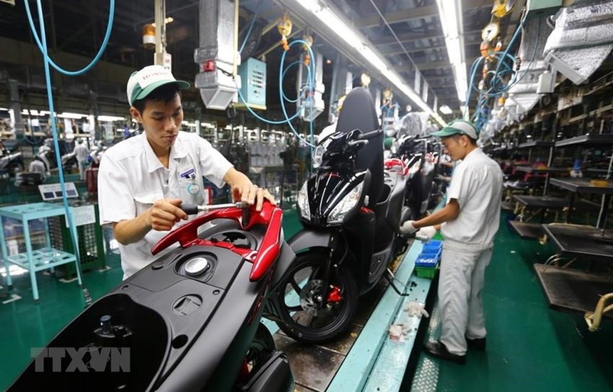 Dây chuyền lắp ráp xe gắn máy tại Công ty TNHH Honda Việt Nam, vốn Kl99ok phiên bản mới của Nhật Bản tại Vĩnh Phúc. (Ảnh: Danh Lam/TTXVN).