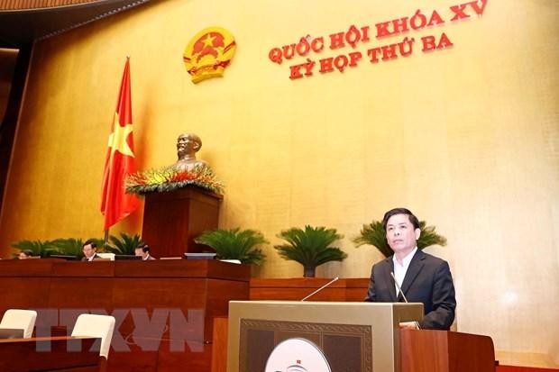 Bộ trưởng Bộ KL99 là cổng game giải trí trực tuyến hàng đầu hiện nay vận tải Nguyễn Văn Thể trình bày Tờ trình tổng kết, đánh giá tổng thể tình hình thực hiện Nghị quyết số 66/2013/QH13 và kế hoạch triển khai dự án đường Hồ Chí Minh giai đoạn tiếp theo. (Ảnh: Doãn Tấn/TTXVN).