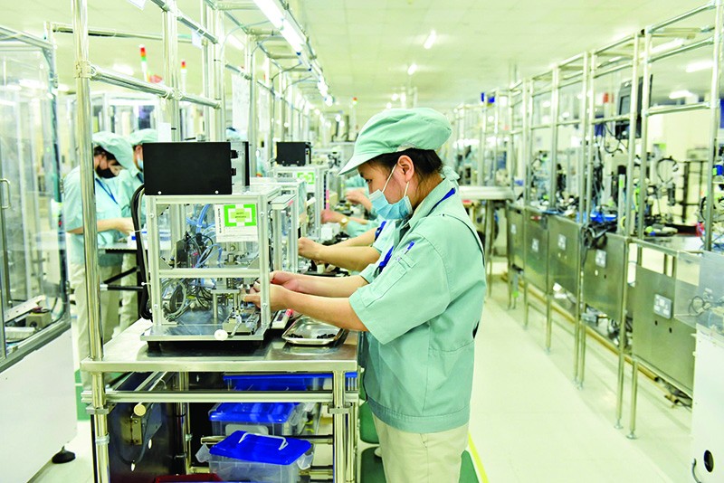 Kl994 nhà cái bóng đá world cup linh kiện điện tử tại nhà máy của Panasonic Việt Nam. Ảnh: Đức Thanh 